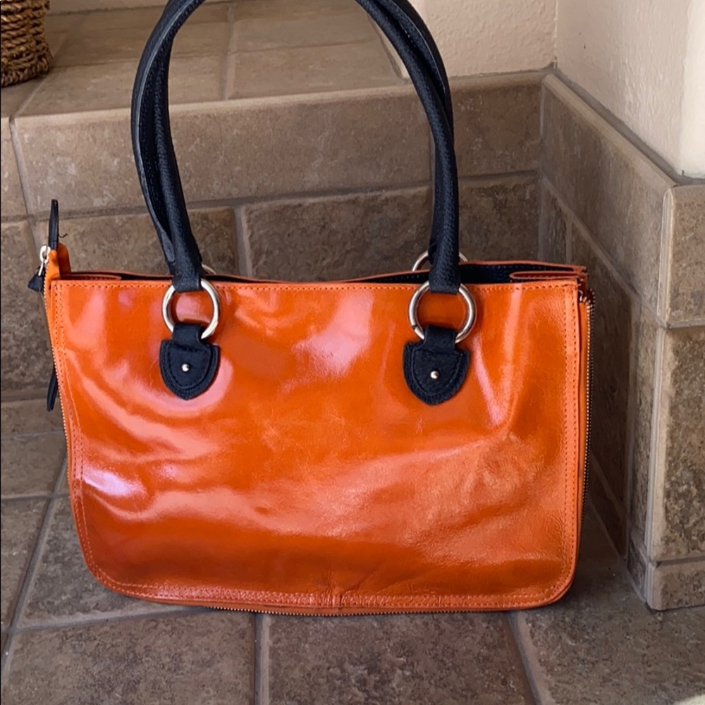 Cleo & Patek Paris leather handbag.